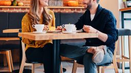 Picture of young couple on a date at cafe