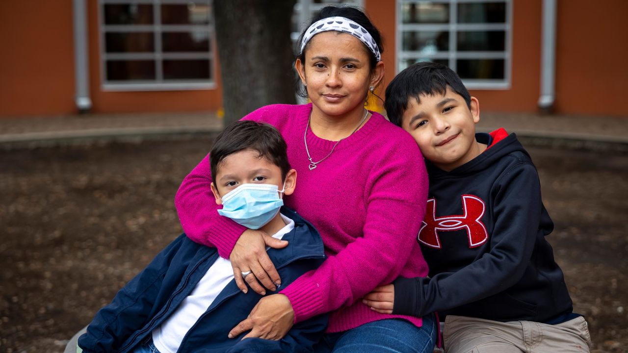 Diana Lopez, center, recently quit her job at a restaurant because she was afraid maskless coworkers could get her sick and put her sons Yeremy and Geovanny at risk.