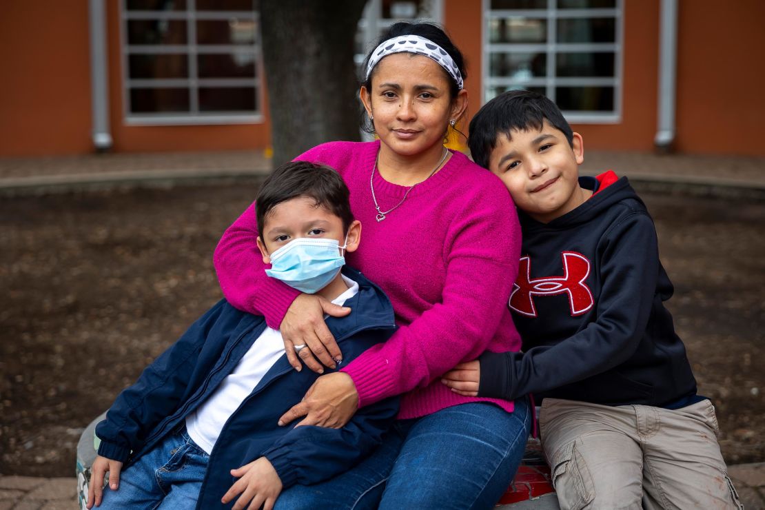 Diana Lopez, center, recently quit her job at a restaurant because she was afraid maskless coworkers could get her sick and put her sons Yeremy and Geovanny at risk.