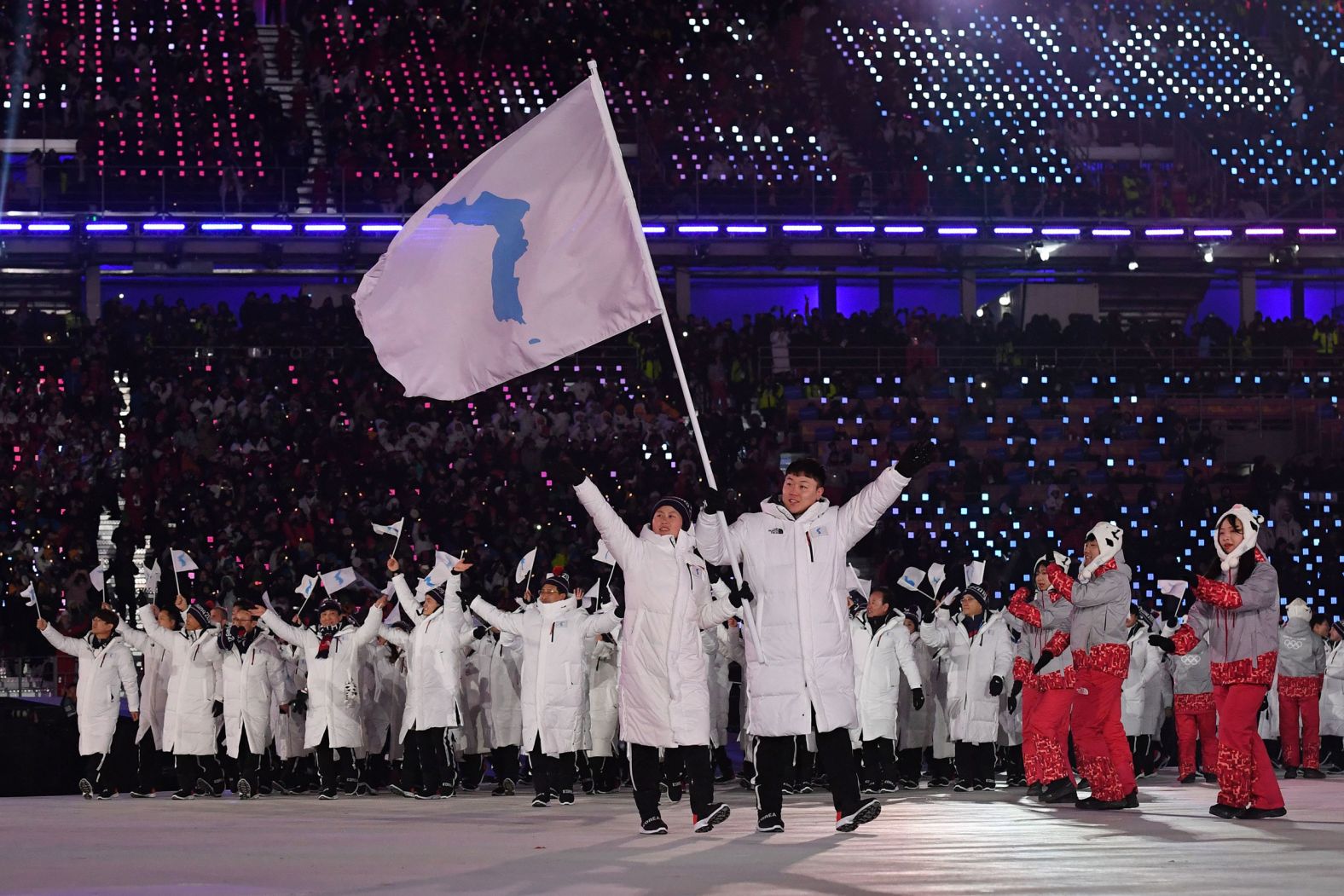 Athletes from North and South Korea marched together and waved flags of a unified Korea during the opening ceremony that took place in Pyeongchang, South Korea, in 2018. The two countries had marched together only three other times in Olympic history. During the Pyeongchang Games, athletes from both countries also teamed up to play for a unified women's hockey team.