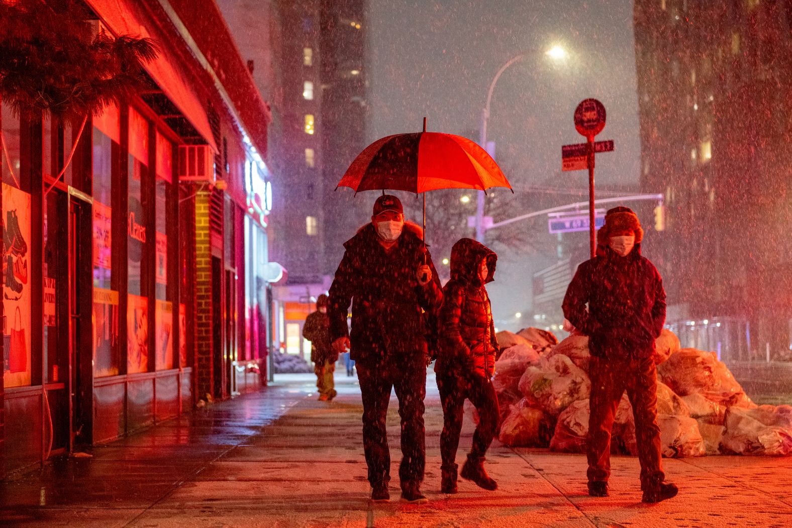 People walk through the snow on Friday, January 28, in New York City. 