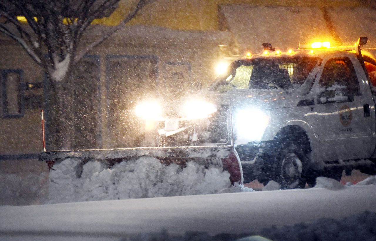 A snowplow clears streets in Rehoboth Beach, Delaware, early Saturday, January 29. 