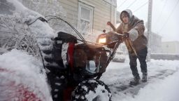Patrick Lawrence clears his driveway of snow at his home in New Bedford, Mass., on Saturday, Jan. 29, 2022.