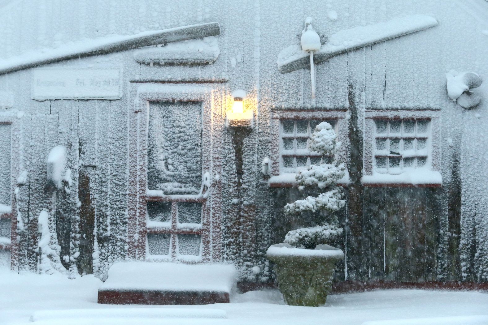 The entrance to Jim's Clam Shack is covered in snow in Falmouth, Massachusetts. 