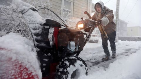 Patrick Lawrence clears his driveway of snow in New Bedford, Massachusetts, on Saturday, January 29.  