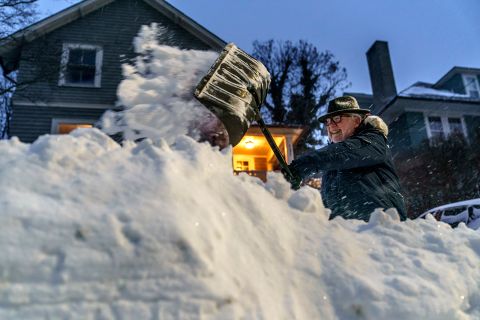 Mike Ratcliffe shovels snow from his driveway in Providence, Rhode Island, on Saturday.