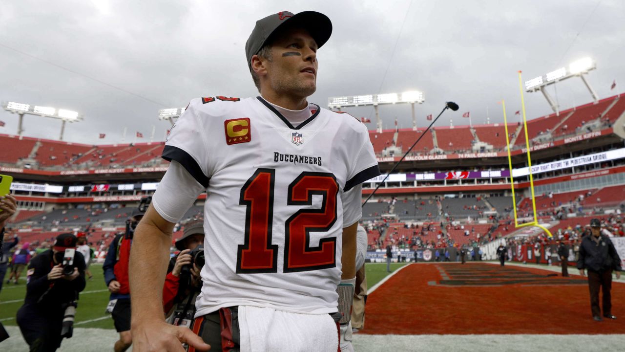 Brady walks off the Raymond James Stadium field after a game.