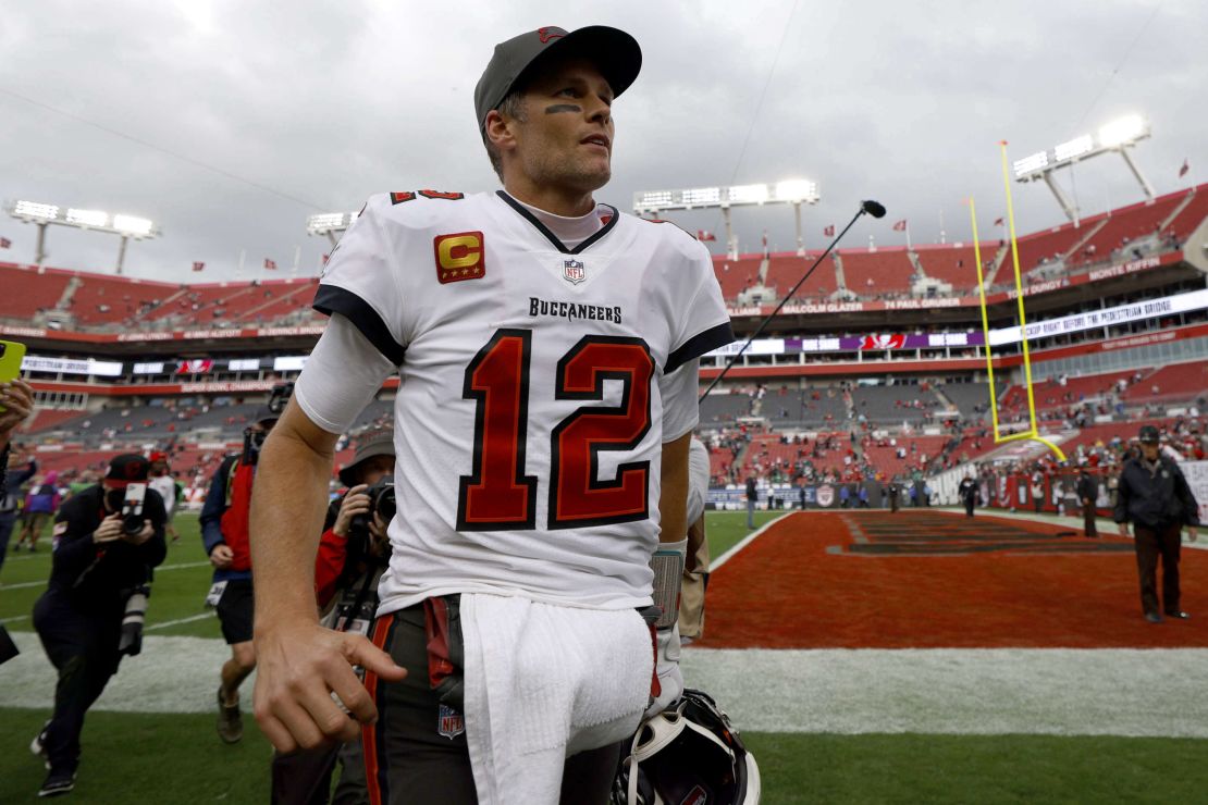 Brady walks off the Raymond James Stadium field after a game. 