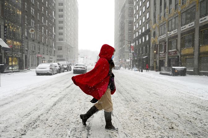 A woman crosses 57th Street during a winter storm that brought more than seven inches of snow and strong wind gusts to New York City, on January 29.