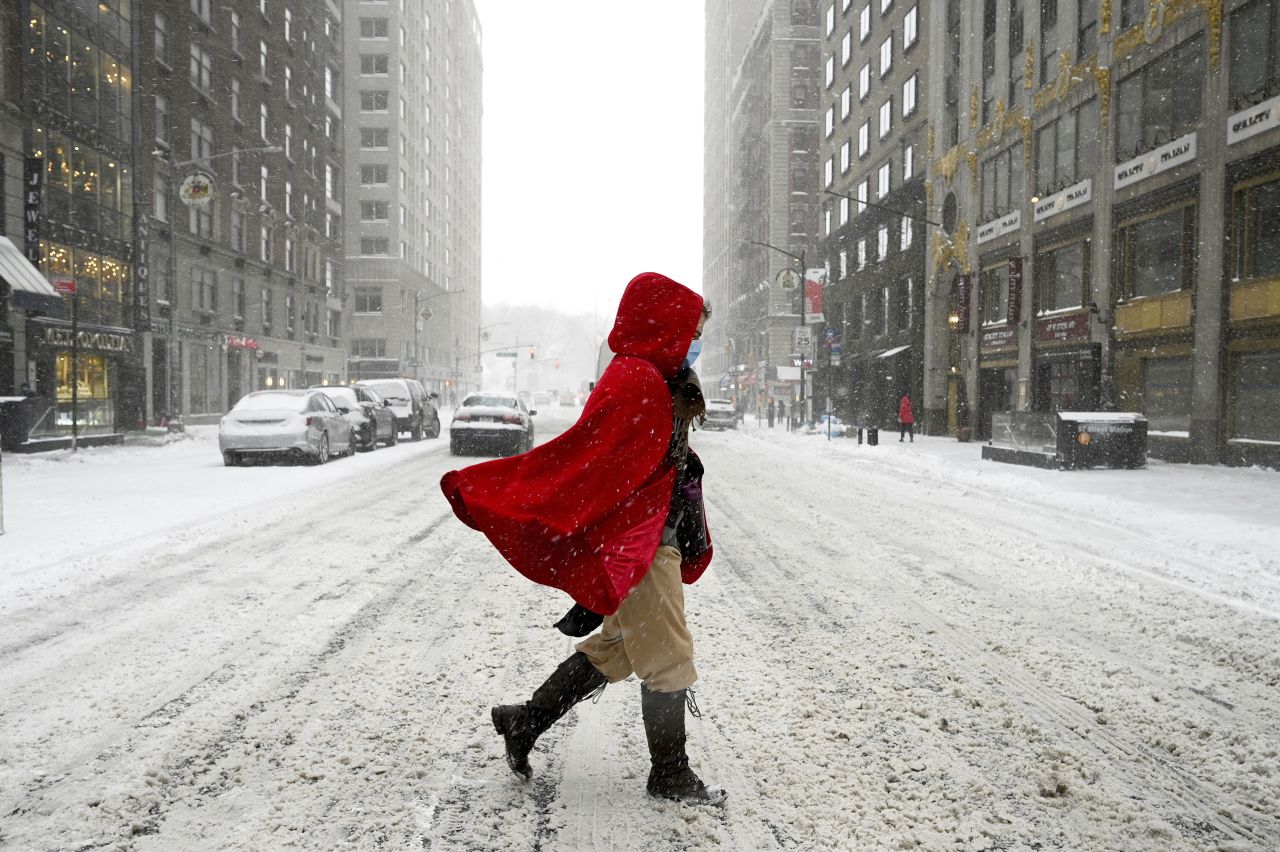 A woman crosses 57th Street during a winter storm that brought more than seven inches of snow and strong wind gusts to New York City, on January 29.