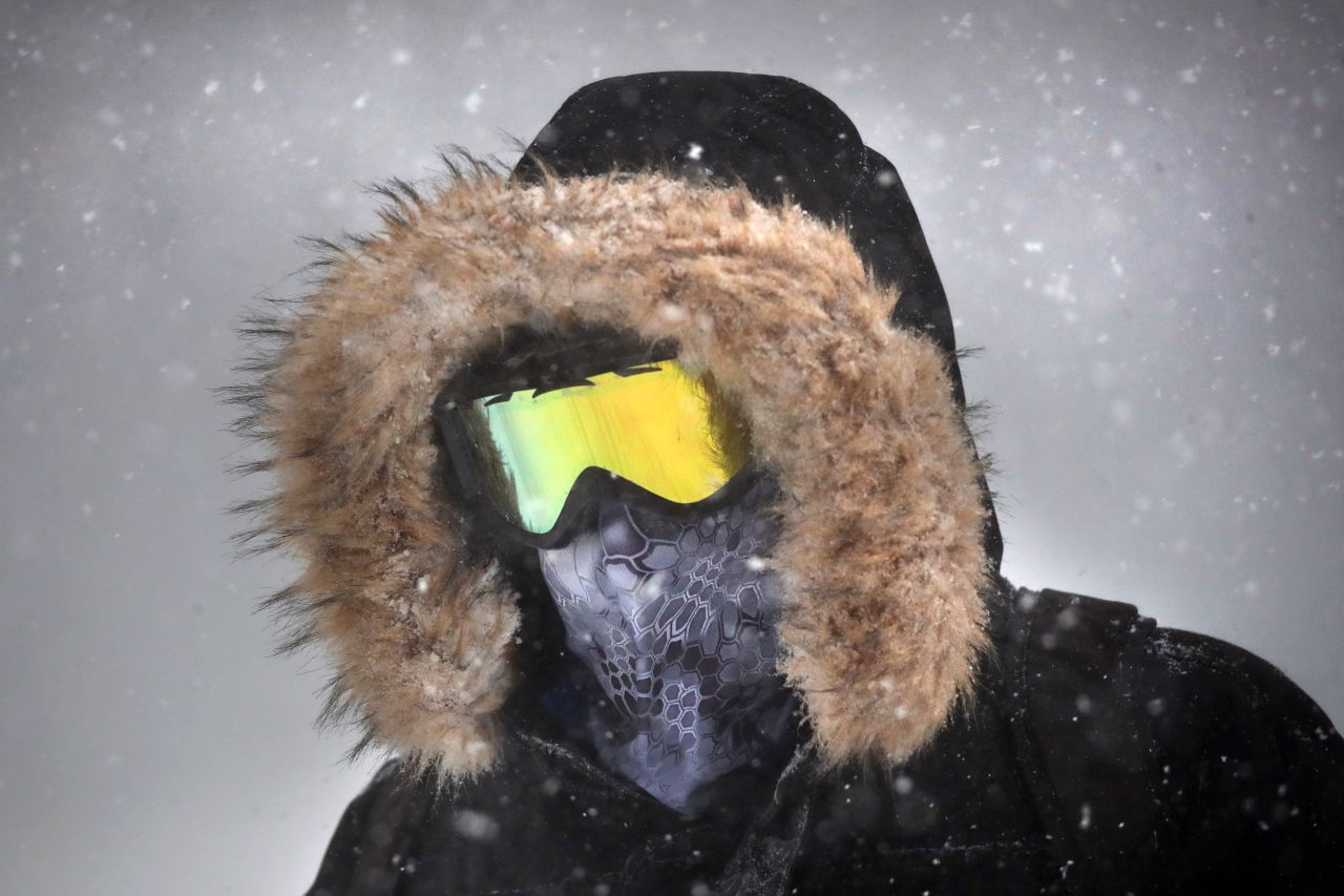 A person wears goggles while walking through the snow in downtown Boston, Massachusetts, on January 29.