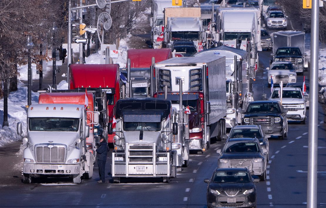 Vehicles from the protest are parked, blocking lanes on a road, on Sunday, January 30, in Ottawa.