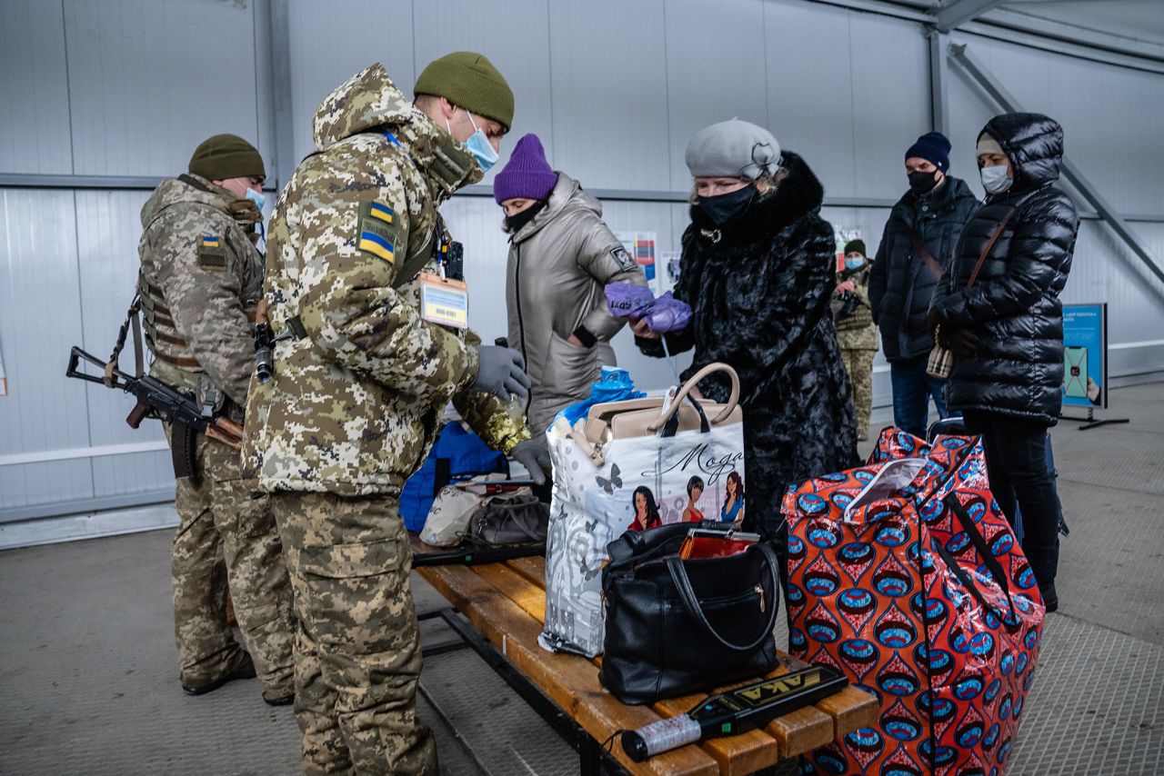 Ukrainians coming from the separatist-held territory stop at the Novotroitskoye checkpoint.