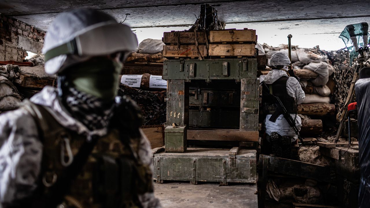 Ukrainian soldiers keep watch on the front line in Avdiivka.