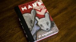 This photo taken in Los Angeles, California on January 27, 2022 shows the cover of the graphic novel "Maus" by Art Spiegelman. 