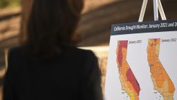 Vice President Kamala Harris reads a briefing poster about drought conditions at the US Forest Service Del Rosa fire station in San Bernardino, California on January 21, 2022.