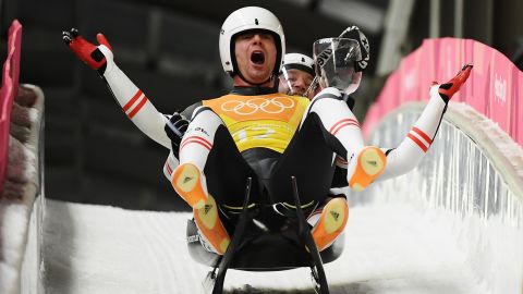 Peter Penz and Georg Fischler of Austria celebrate as they finish a run during the Luge Team Relay on day six of the PyeongChang 2018 Winter Olympics.