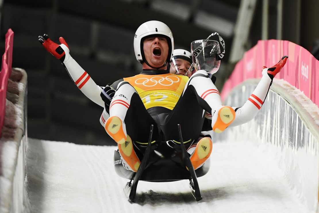 Peter Penz and Georg Fischler of Austria celebrate as they finish a run during the Luge Team Relay on day six of the PyeongChang 2018 Winter Olympics.
