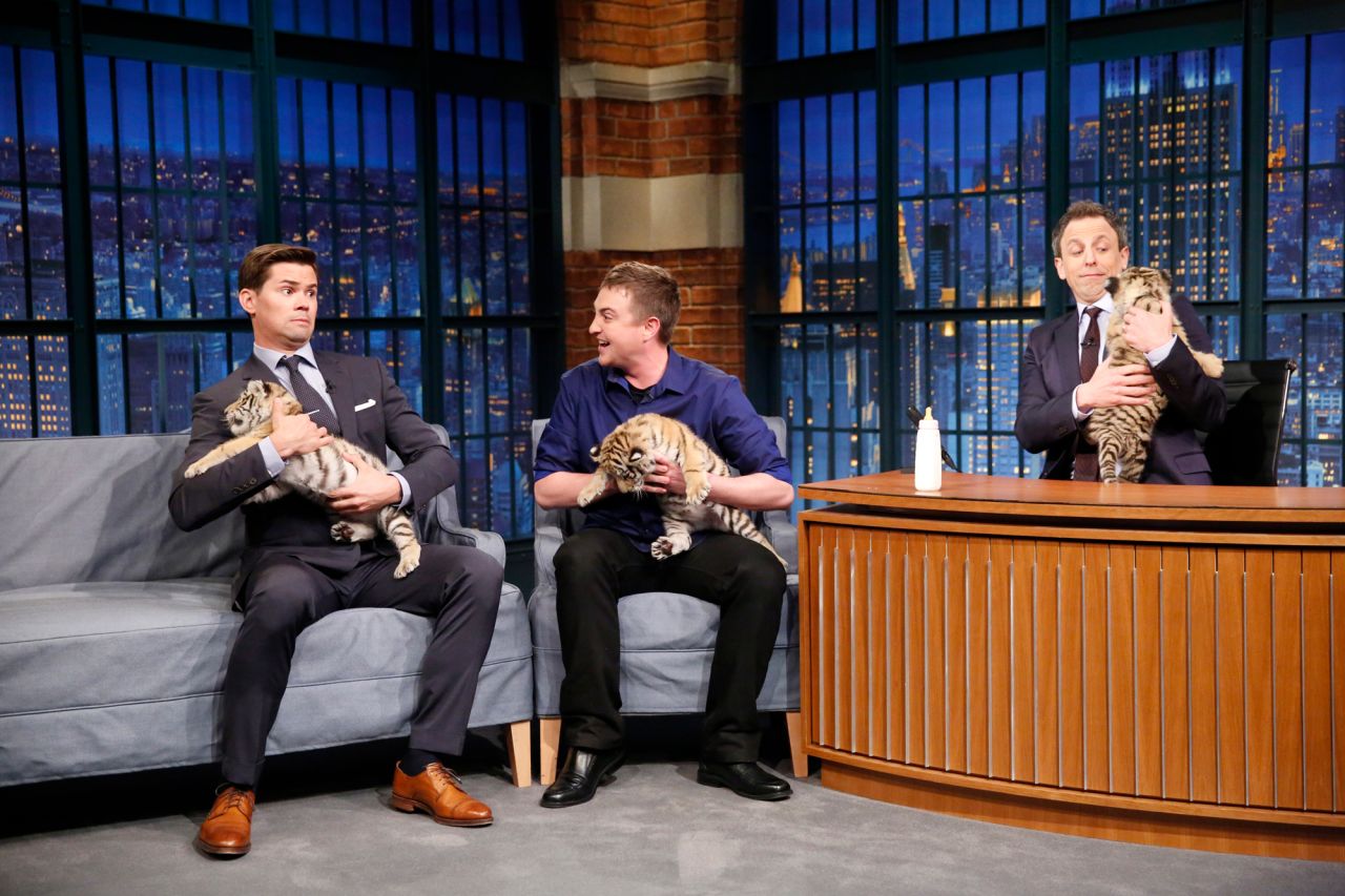 Meyers and actor Andrew Rannells hold baby tigers during a segment with wildlife expert Corbin Maxey in 2016.