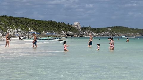 People spend time at Tulum beach, near Mexico's Caribbean beach resort of Tulum, in the Mayan Riviera, Quintana Roo State, on October 30, 2021. - Famed for its ancient Mayan ruins and turquoise waters, Tulum draws thousands of foreign tourists every year as one of the country's top tourist destinations. (Photo by Daniel SLIM / AFP) (Photo by DANIEL SLIM/AFP via Getty Images)