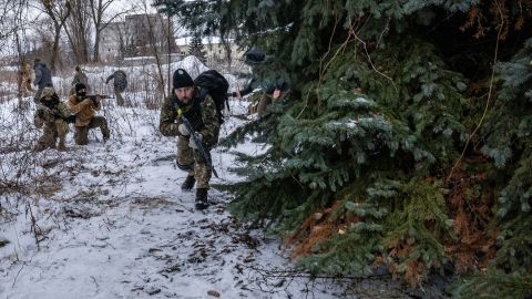 Civilians practice ambush tactics in Kyiv. "I seemed to be the only one who was just feeling the cold," photographer Timothy Fadek said of the freezing temperatures. "Everyone else seemed to be taking it in stride."