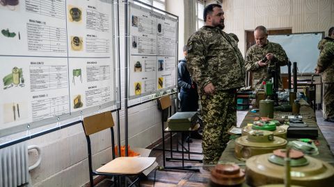 A soldier instructs new reservists on how to identify mines, grenades and other explosive devices. "One of the trainers surprised everyone by detonating a detonation cap, which is like a large firecracker," Fadek said. "It's used to detonate a larger explosive. My ears are still ringing."