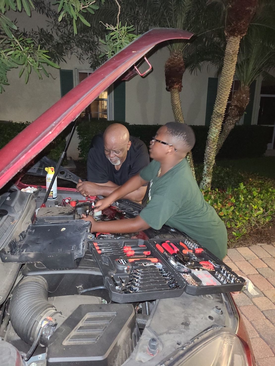 Donald Fennoy took this photo of his father and son moments after realizing he had to quit his job to spend more time with them.