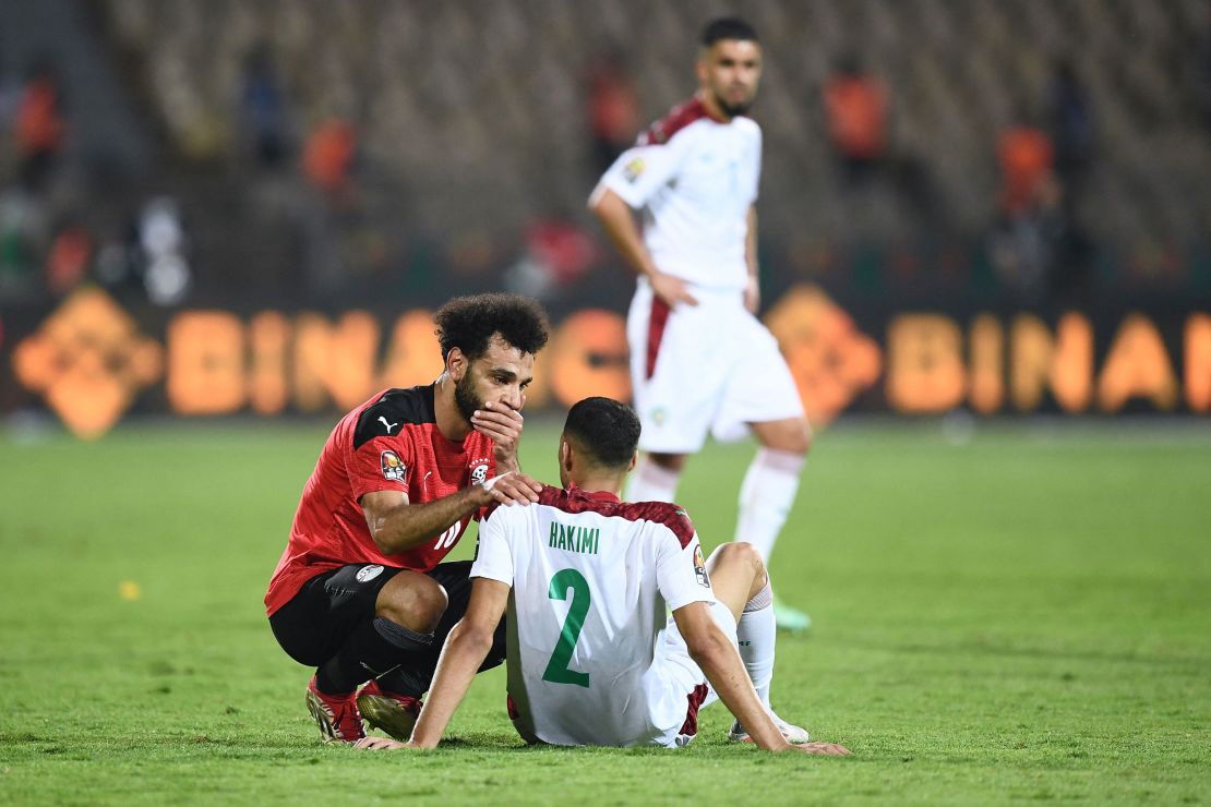 Respect between rivals: After his side's 2-1 win in the quarterfinals of the African Cup of Nations on Sunday, Egypt's Mohamed Salah consoles Morocco's Achraf Hakimi. Egypt will play hosts Cameroon in the semifinals on Thursday.