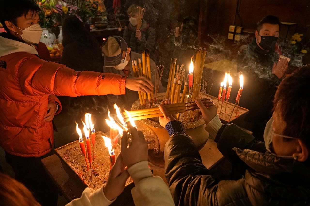 People pray at the Man Mo Temple in Hong Kong during Lunar New Year celebrations on February 1.