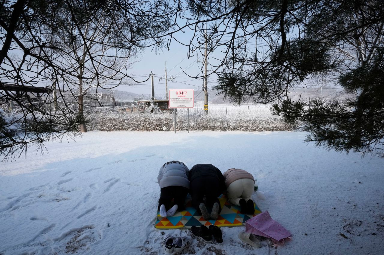 North Korean refugees and their family members pay respect to their ancestors as they visit the Imjingak Pavilion in Paju, South Korea, on February 1. The pavilion is near the North Korean border.