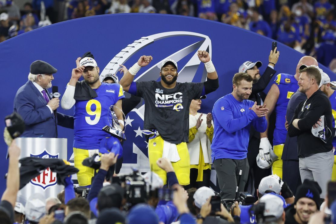 Stafford (left), Aaron Donald (middle) and McVay (right) react with the George Halas Trophy after defeating the San Francisco 49ers in the NFC Championship game.