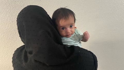 Nasema holds her baby boy, Wisal, in Houston.