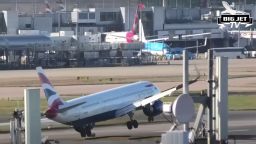 The British Airways plane toppled to the left before appearing to strike the tarmac with its tail and then performing a safe go-around.