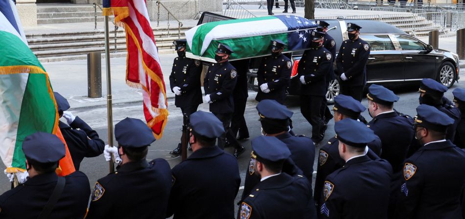 Mora's casket is carried to his wake in New York on Tuesday, February 1. 