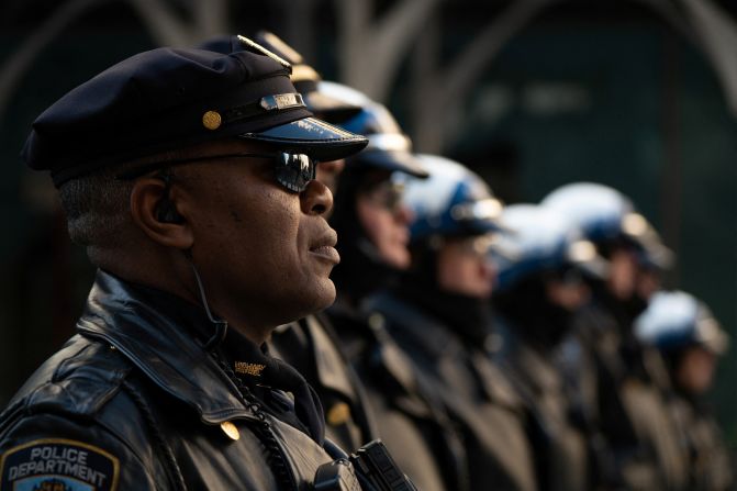 Police officers line up for the transfer of Mora's casket on February 1.