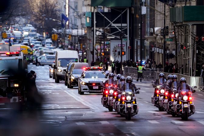 A hearse carries Mora's casket to St. Patrick's Cathedral.