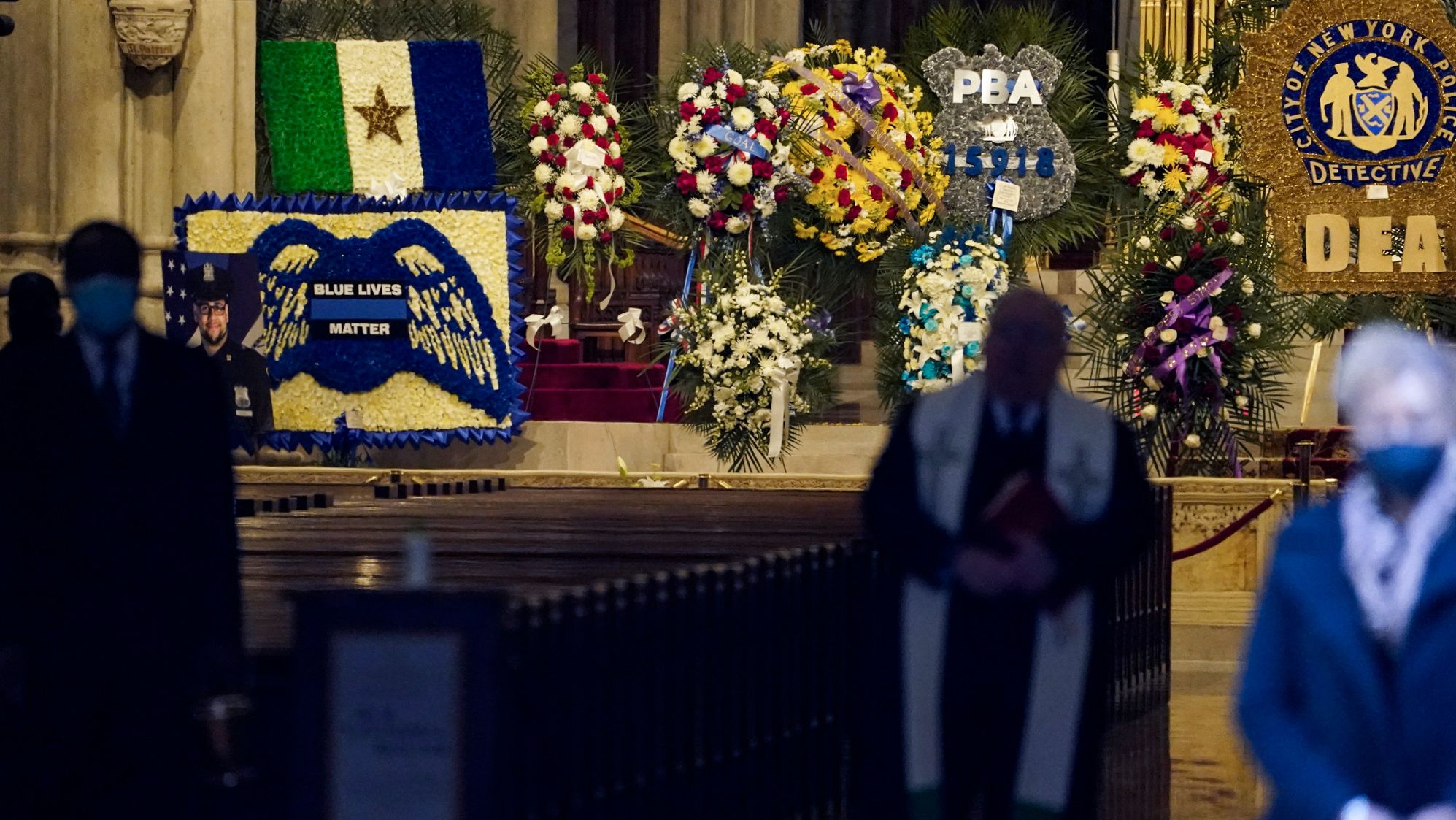 Flowers are displayed for Mora at St. Patrick's Cathedral.