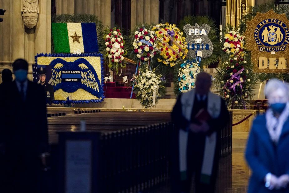 Flowers are displayed for Mora at St. Patrick's Cathedral.