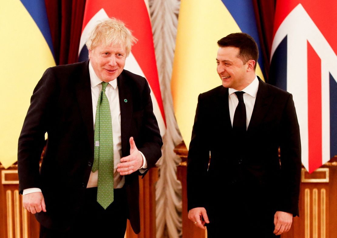 British Prime Minister Boris Johnson (L) is welcomed by Ukraine's President Volodymyr Zelensky at the Presidential Palace, in Kyiv on February 1, 2022. 