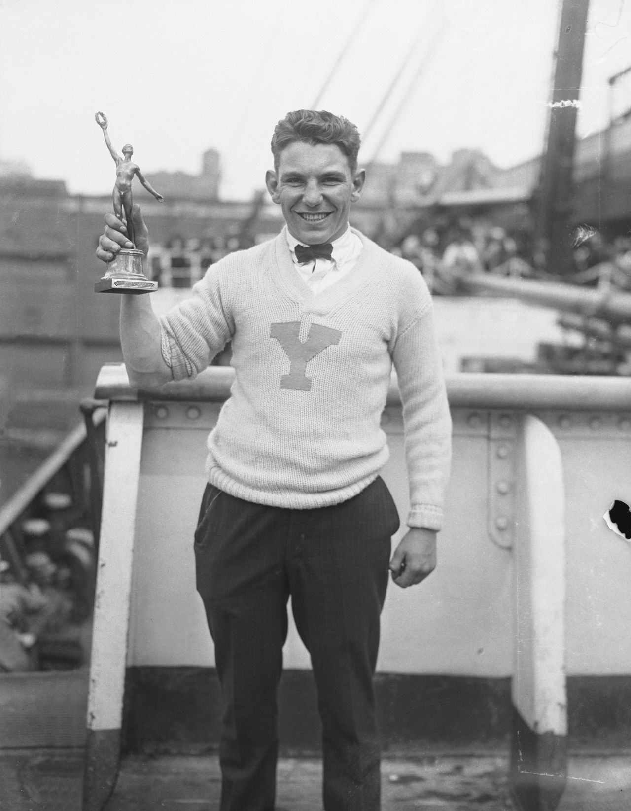 American Eddie Eagan holds his trophy after winning an Olympic gold medal in boxing in 1920. Eagan is the only person in history to win Olympic gold medals in both a summer and winter sport.