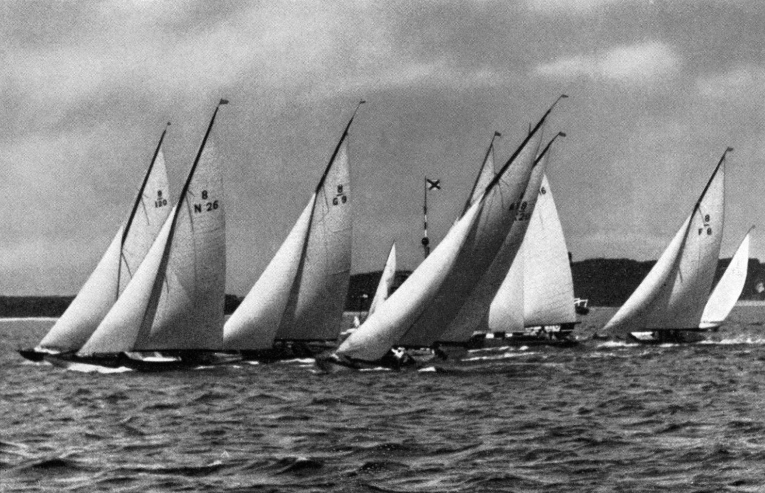 Thams won a silver medal as part of a sailing crew at the 1936 Summer Games. His boat is seen second from left.
