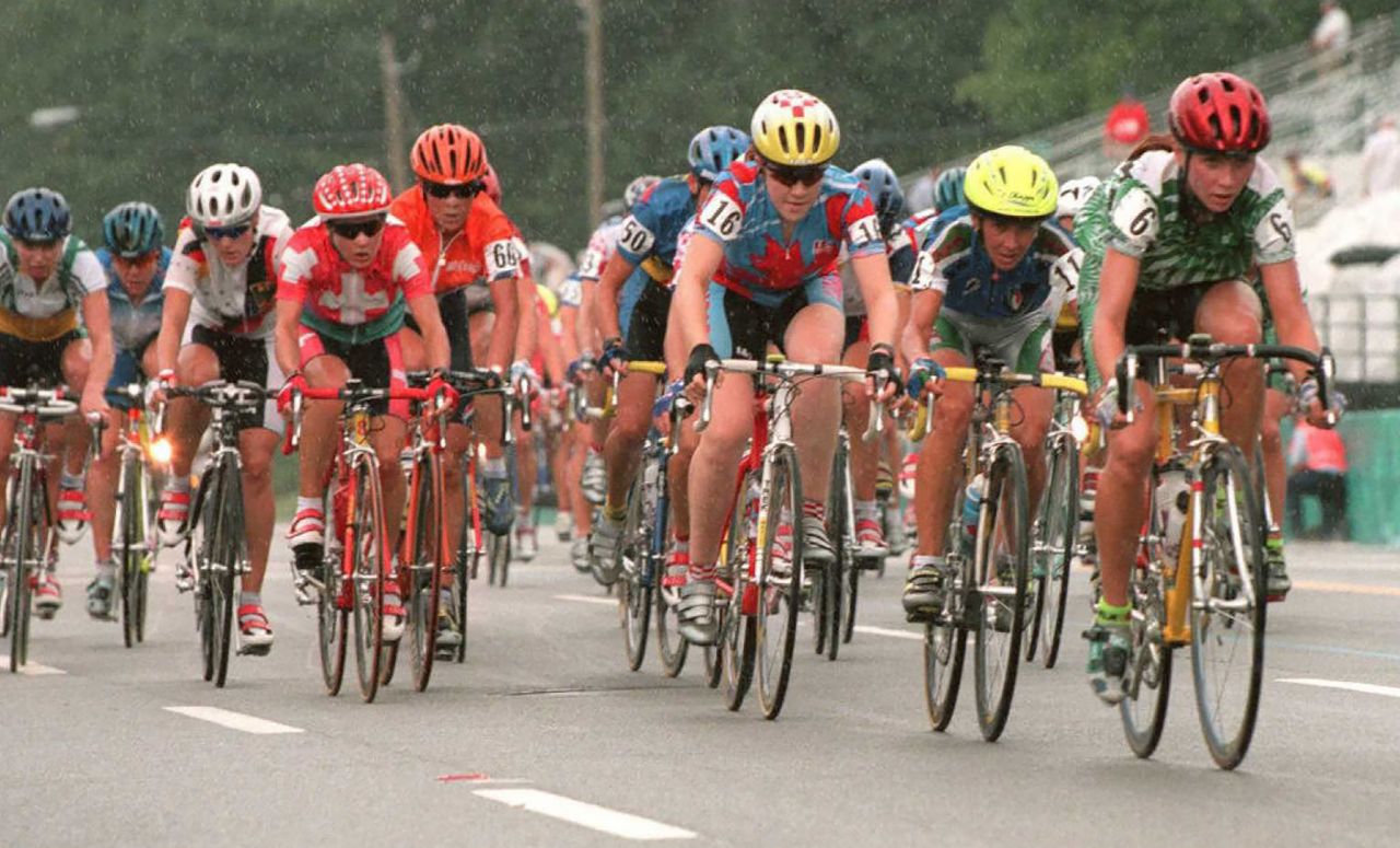 Canadian Clara Hughes, seen at center in the yellow helmet, races through the streets of Atlanta on her way to winning a bronze medal at the 1996 Summer Games. She won two bronzes that year.