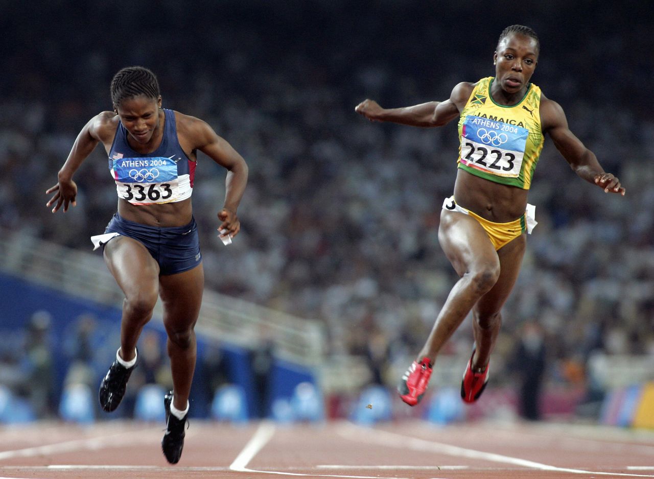 American Lauryn Williams, left, finishes just ahead of Jamaica's Veronica Campbell during the 100-meter dash at the 2004 Summer Olympics. Williams took home the silver. She later added a gold medal in the 4x100 relay in 2012.