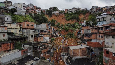 Firefighters search for survivors after heavy rains caused a landslide in Soa Paulo state, Brazil in January.