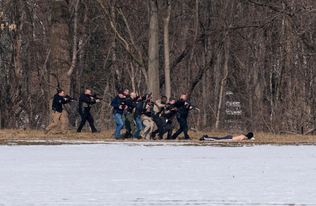 Police approach a person of interest following shootings in Bridgewater, Virginia, on Tuesday, February 1. A former student-athlete at Bridgewater College <a href="https://www.cnn.com/2022/02/02/us/bridgewater-college-shooting-wednesday/index.html" target="_blank">is accused of killing two police officers at the school.</a> Alexander Wyatt Campbell, 27, has been charged with five felonies, including murder. The two police officers, John Painter and JJ Jefferson, were responding to emergency calls of a suspicious man at the college, police said.
