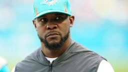 Miami Dolphins head coach Brian Flores stands on the field before an NFL football game against the New York Giants, Sunday, Dec. 5, 2021, in Miami Gardens, Fla. (AP Photo/Wilfredo Lee)