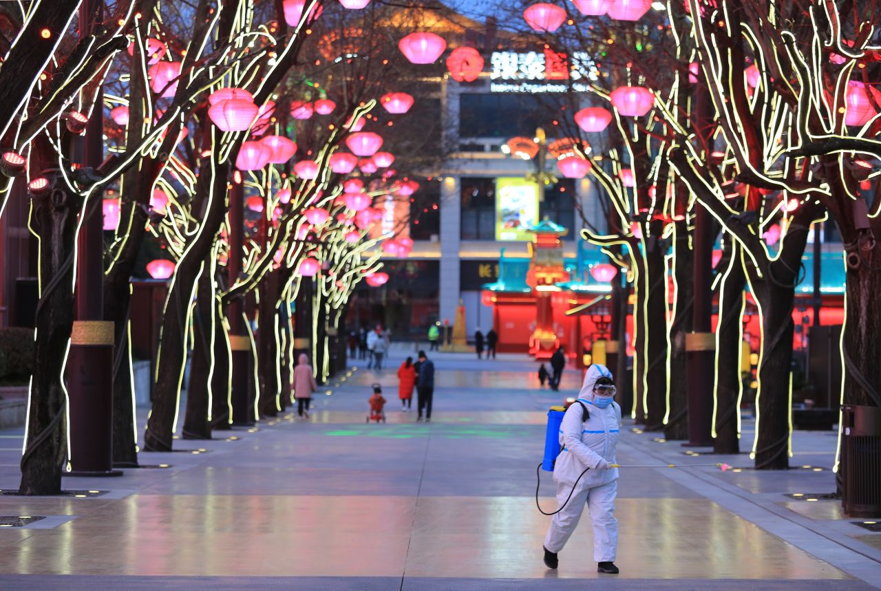 A worker disinfects the ground in Xi'an, China, on January 31.