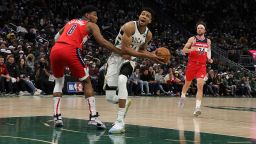 MILWAUKEE, WISCONSIN - FEBRUARY 01: Giannis Antetokounmpo #34 of the Milwaukee Bucks drives to the basket against Rui Hachimura #8 of the Washington Wizards during the first half of a game at Fiserv Forum on February 01, 2022 in Milwaukee, Wisconsin. NOTE TO USER: User expressly acknowledges and agrees that, by downloading and or using this photograph, User is consenting to the terms and conditions of the Getty Images License Agreement. (Photo by Stacy Revere/Getty Images)
