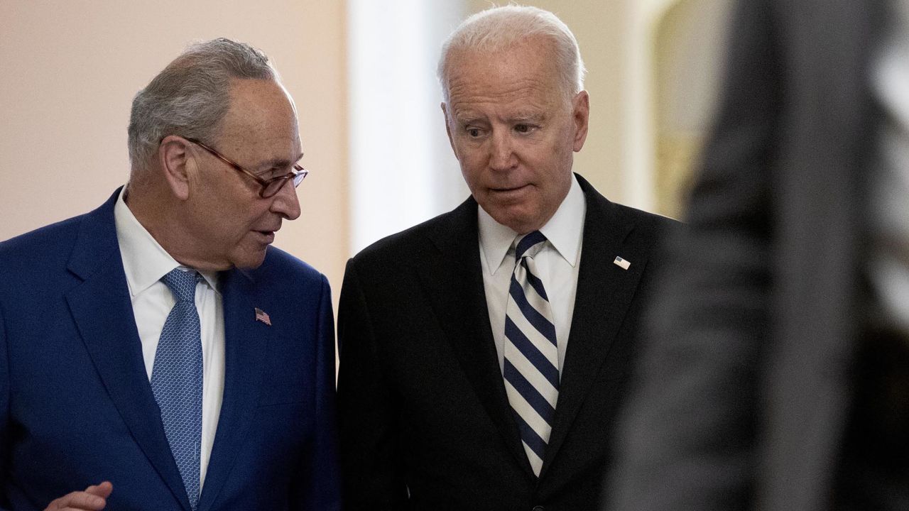 President Joe Biden departs from the US Capitol with Senate Majority Leader Chuck Schumer in July 2021.