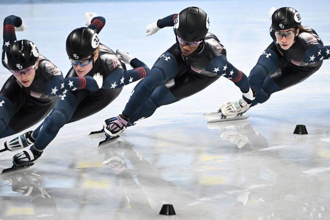 Members of the US short track speed skating team, including Biney (C) and Julie Letai (R), take part in a training session in Beijing.